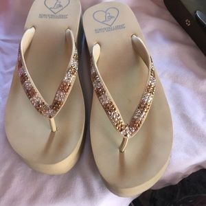 Lightly worn lady lanell flip flops